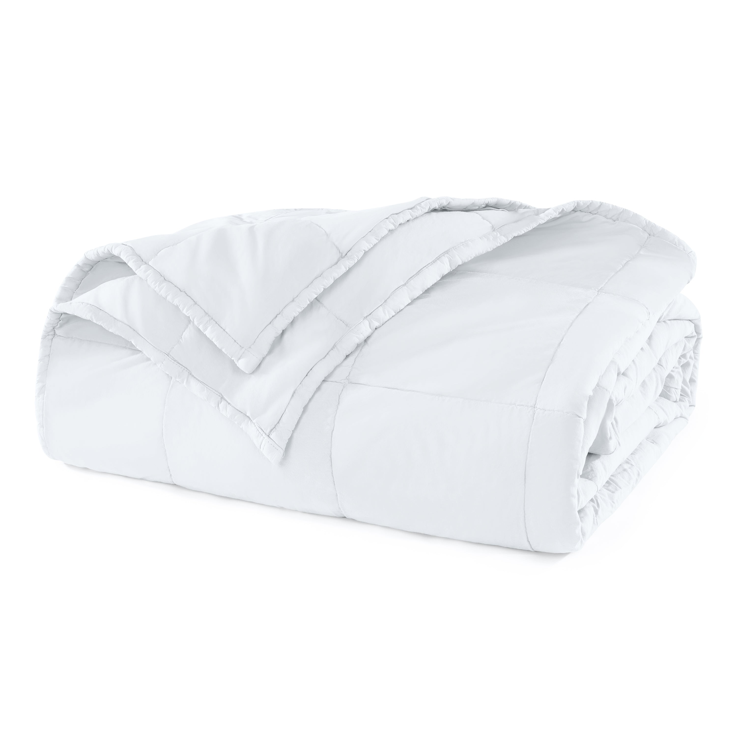 Folded white comforter on a white background