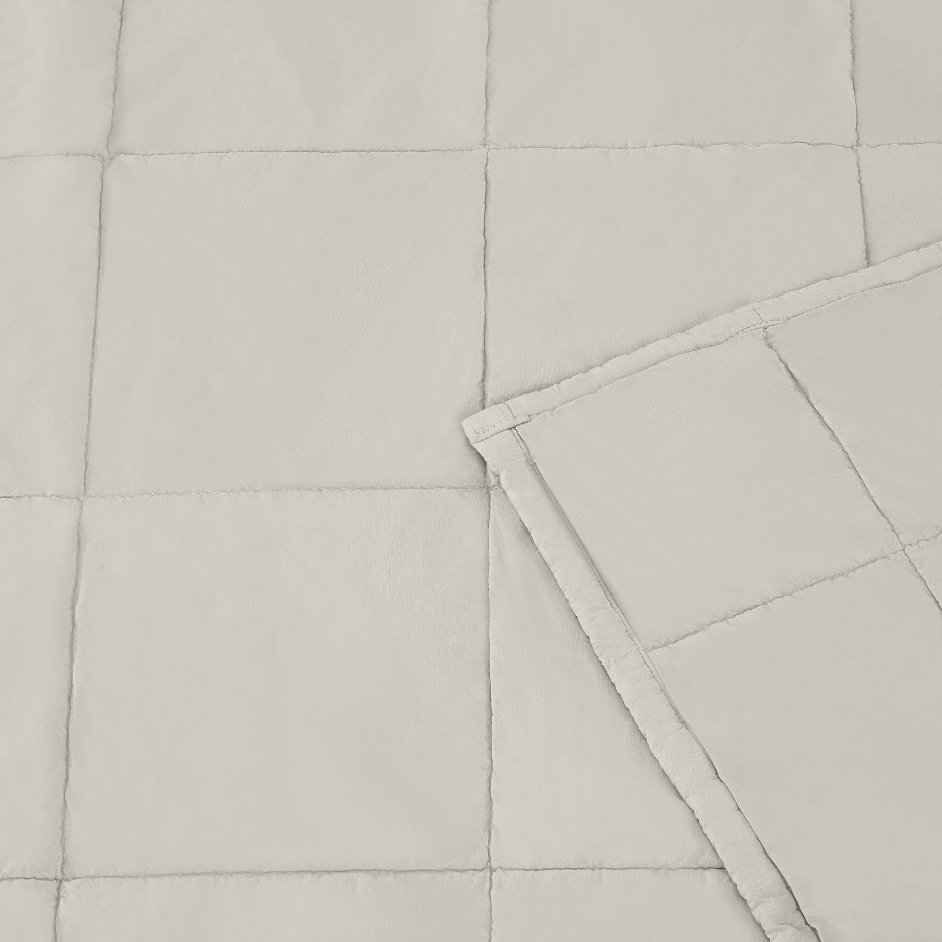 Lunar Rock blanket with a folded corner on a light gray background