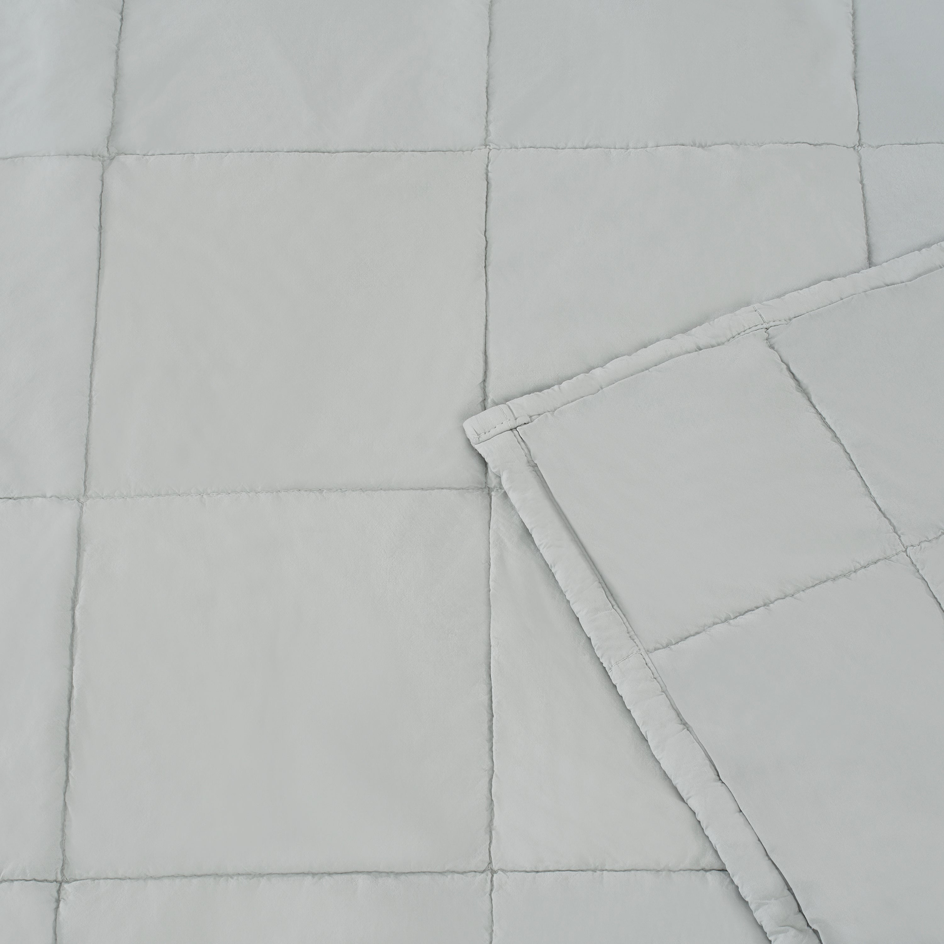 Metal quilted blanket with a folded corner