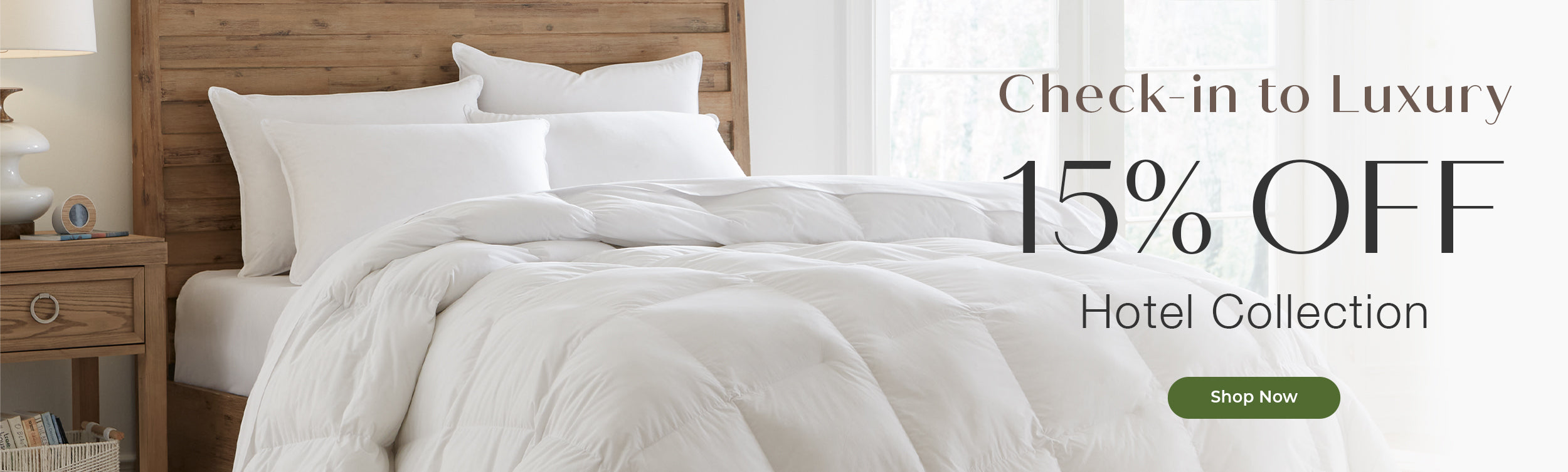 A bed dressed in white bedding and pillows, set against a wooden headboard and bedside table, with promotional text reading 'Check-in to Luxury 15% OFF Hotel Collection' and a green 'Shop Now' button.